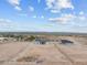 Large lot showcasing two homes, fully fenced, with desert landscape and clear blue skies at 28848 W Grand Ave, Wittmann, AZ 85361