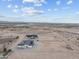 Stunning aerial view of two homes in a desert landscape with distant mountains under a beautiful sky at 28848 W Grand Ave, Wittmann, AZ 85361
