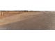 Spacious backyard with gravel and fencing, ready for your custom landscaping ideas and recreational use at 28848 W Grand Ave, Wittmann, AZ 85361