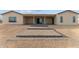 Stepstone patio leading to large covered porch. Easy access to outdoor desert living at 28848 W Grand Ave, Wittmann, AZ 85361
