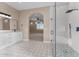 Stylish bathroom featuring a glass shower, modern vanity, and elegant tile flooring at 28848 W Grand Ave, Wittmann, AZ 85361