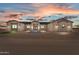 Charming one-story home with desert landscaping, neutral palette and inviting front entrance at 28848 W Grand Ave, Wittmann, AZ 85361