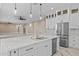Close up of the kitchen island, stainless appliances, modern cabinets, pendant lighting, and a bright and airy feel at 28848 W Grand Ave, Wittmann, AZ 85361