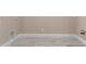Practical laundry area with tile flooring, utility connections, and ample space at 28848 W Grand Ave, Wittmann, AZ 85361