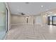 Bright living room with herringbone floors, recessed lighting, and an open feel with backyard access at 28848 W Grand Ave, Wittmann, AZ 85361