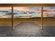 Covered patio view showcasing serene desert landscape and mountain backdrop at 28848 W Grand Ave, Wittmann, AZ 85361