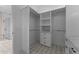 Spacious walk-in closet featuring custom shelving, drawers, and ample storage at 28848 W Grand Ave, Wittmann, AZ 85361