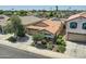 An aerial view of the house featuring a tile roof, solar panels, and manicured landscaping at 2955 E Flossmoor Ave, Mesa, AZ 85204