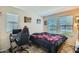 A cozy bedroom with two windows and decor at 2955 E Flossmoor Ave, Mesa, AZ 85204
