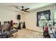 Bedroom with a ceiling fan, carpeted floors, and a window at 2955 E Flossmoor Ave, Mesa, AZ 85204