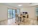 Charming dining area with table, chairs, and natural light streaming through sliding glass doors at 2955 E Flossmoor Ave, Mesa, AZ 85204