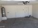 Clean garage interior with a water heater, offering potential for parking or storage at 2955 E Flossmoor Ave, Mesa, AZ 85204