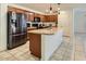 Spacious kitchen with stainless steel appliances, granite countertop island, and ample cabinet space at 2955 E Flossmoor Ave, Mesa, AZ 85204