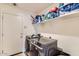 Well-equipped laundry room with modern washer, dryer, and ample shelving for storage at 2955 E Flossmoor Ave, Mesa, AZ 85204