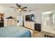 Main bedroom with carpet, dressers, a walk-in closet, and bathroom at 2955 E Flossmoor Ave, Mesa, AZ 85204