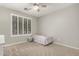 Comfortable bedroom with neutral walls and a window at 3006 E Lexington Ave, Gilbert, AZ 85234