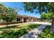 Inviting single Gathering house with lush green lawn, mature trees and a well manicured front yard at 3006 E Lexington Ave, Gilbert, AZ 85234