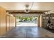 Well-organized garage featuring built-in cabinets, an open garage door, and storage space at 3006 E Lexington Ave, Gilbert, AZ 85234
