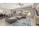 Inviting living room featuring a sectional sofa, contemporary furnishings, and lots of natural light at 3006 E Lexington Ave, Gilbert, AZ 85234