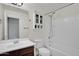 This bathroom features a shower/tub, a built in cabinet, and a vanity at 3036 N Acacia Way, Buckeye, AZ 85396
