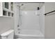 This bathroom includes a shower/tub combo and a built-in storage cabinet at 3036 N Acacia Way, Buckeye, AZ 85396