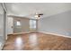 Spacious bedroom with wood floors, neutral walls and bright windows at 3036 N Acacia Way, Buckeye, AZ 85396