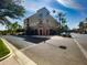 An exterior view of the apartments featuring balconies, brick accents, and street-side retail shops at 3036 N Acacia Way, Buckeye, AZ 85396