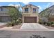 Charming two-story home with a well-manicured front yard and a two car garage at 3036 N Acacia Way, Buckeye, AZ 85396