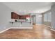 Modern kitchen with granite countertops, stainless steel appliances, and wood flooring at 3036 N Acacia Way, Buckeye, AZ 85396
