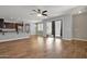 Bright, open living area with wood flooring and plenty of natural light at 3036 N Acacia Way, Buckeye, AZ 85396