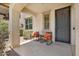 Cozy front porch with seating, offering a relaxing outdoor space at 3036 N Acacia Way, Buckeye, AZ 85396