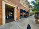 Street view of a restaurant with outdoor patio seating beneath an awning and a brick façade at 3036 N Acacia Way, Buckeye, AZ 85396