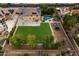 Expansive backyard featuring a lush lawn, pool, fire pit, and outdoor seating, perfect for entertaining at 3944 W Paradise Ln, Phoenix, AZ 85053