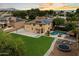 Aerial view of a two-story house with a large yard, pool, and solar panels at 3944 W Paradise Ln, Phoenix, AZ 85053
