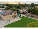 Aerial view showing a two-story house with pool, fire pit, and expansive lawn at 3944 W Paradise Ln, Phoenix, AZ 85053