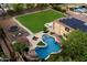 Aerial view showcasing a large backyard with a pool, spa, and grassy area at 3944 W Paradise Ln, Phoenix, AZ 85053