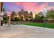 Spacious backyard with large concrete patio, basketball hoop, and well-maintained lawn at 3944 W Paradise Ln, Phoenix, AZ 85053