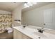 Bathroom featuring a double sink vanity and shower with tree-themed curtain at 3944 W Paradise Ln, Phoenix, AZ 85053
