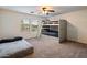 Shared bedroom with a bunk bed and additional twin bed, offering a cozy living space at 3944 W Paradise Ln, Phoenix, AZ 85053