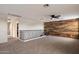 Upstairs bonus room featuring carpet, wrought iron railing, and wood accent wall at 3944 W Paradise Ln, Phoenix, AZ 85053