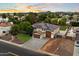 Aerial shot showcasing a property with a three-car garage and mature trees at 3944 W Paradise Ln, Phoenix, AZ 85053