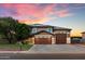 Charming two-story home featuring a three-car garage, desert landscaping, and solar panels at 3944 W Paradise Ln, Phoenix, AZ 85053