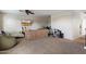 Casual living space with carpet, a mounted TV, comfy seating, and an abundance of personal touches at 3944 W Paradise Ln, Phoenix, AZ 85053