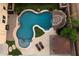 Aerial view highlighting a luxurious pool area with a slide and relaxing features at 3944 W Paradise Ln, Phoenix, AZ 85053