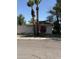 Charming single-story home featuring palm trees and a vibrant red front door at 404 W 11Th St, Tempe, AZ 85281