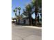 Cozy single-story home with a red front door and mature palm trees at 404 W 11Th St, Tempe, AZ 85281