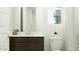 Bright bathroom features a modern vanity with dark wood cabinets and a stylish shower curtain at 4707 E French Rd, San Tan Valley, AZ 85143