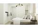 Bright bedroom with modern lighting, sleek mirror, and convenient closet space at 4707 E French Rd, San Tan Valley, AZ 85143