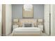 Relaxing bedroom with soft lighting, comfortable pillows, and minimalist decor at 4707 E French Rd, San Tan Valley, AZ 85143
