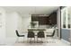 Dining area with stylish chairs, natural light, and view to the kitchen at 4707 E French Rd, San Tan Valley, AZ 85143